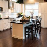 kitchen with black countertops and white cabinets remodeled by contractors in portland