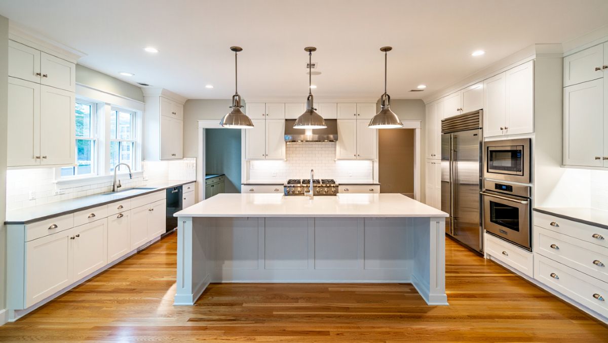 Modern Kitchen Remodel With White Cabinets And Island