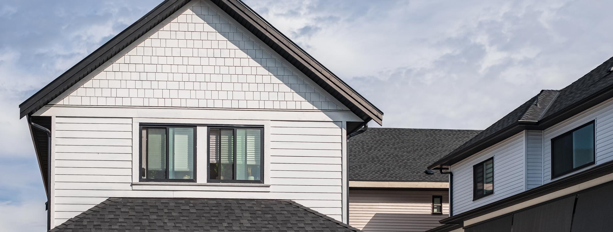 Home exterior with clean white siding