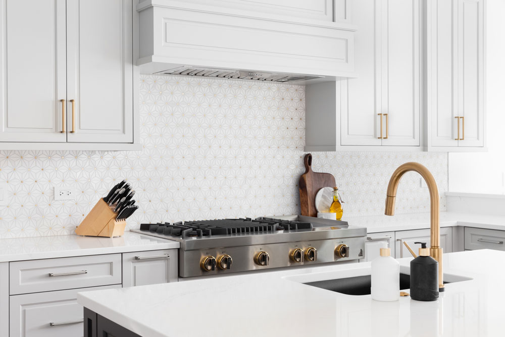 White kitchen remodel with clean cabinetry and bright finishes